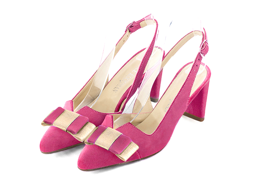 Fuschia pink and gold open back shoes, with a knot. Tapered